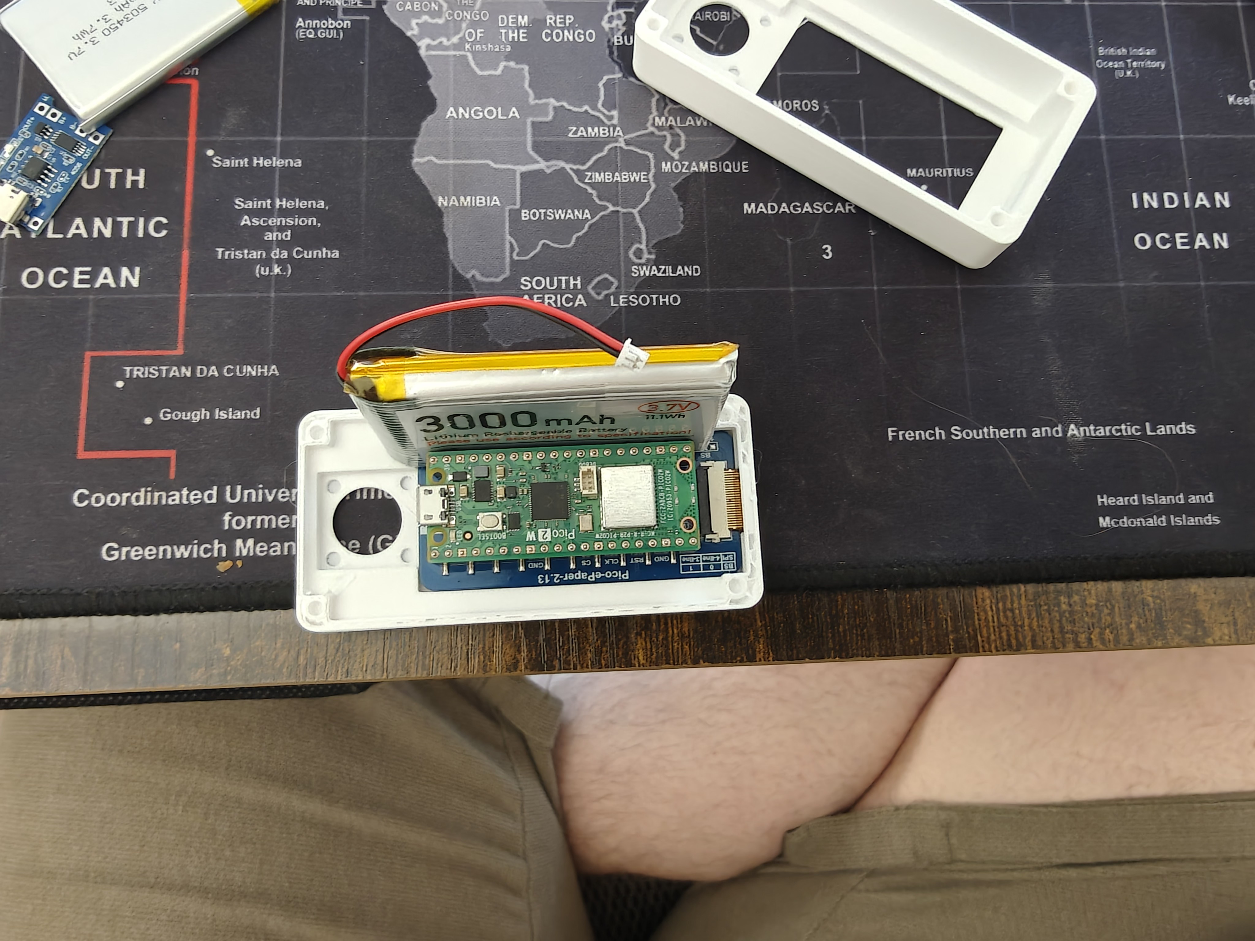 3000 mAh LiPo laid on top of the Rev 2 base with the Pico-ePaper-2.13 installed