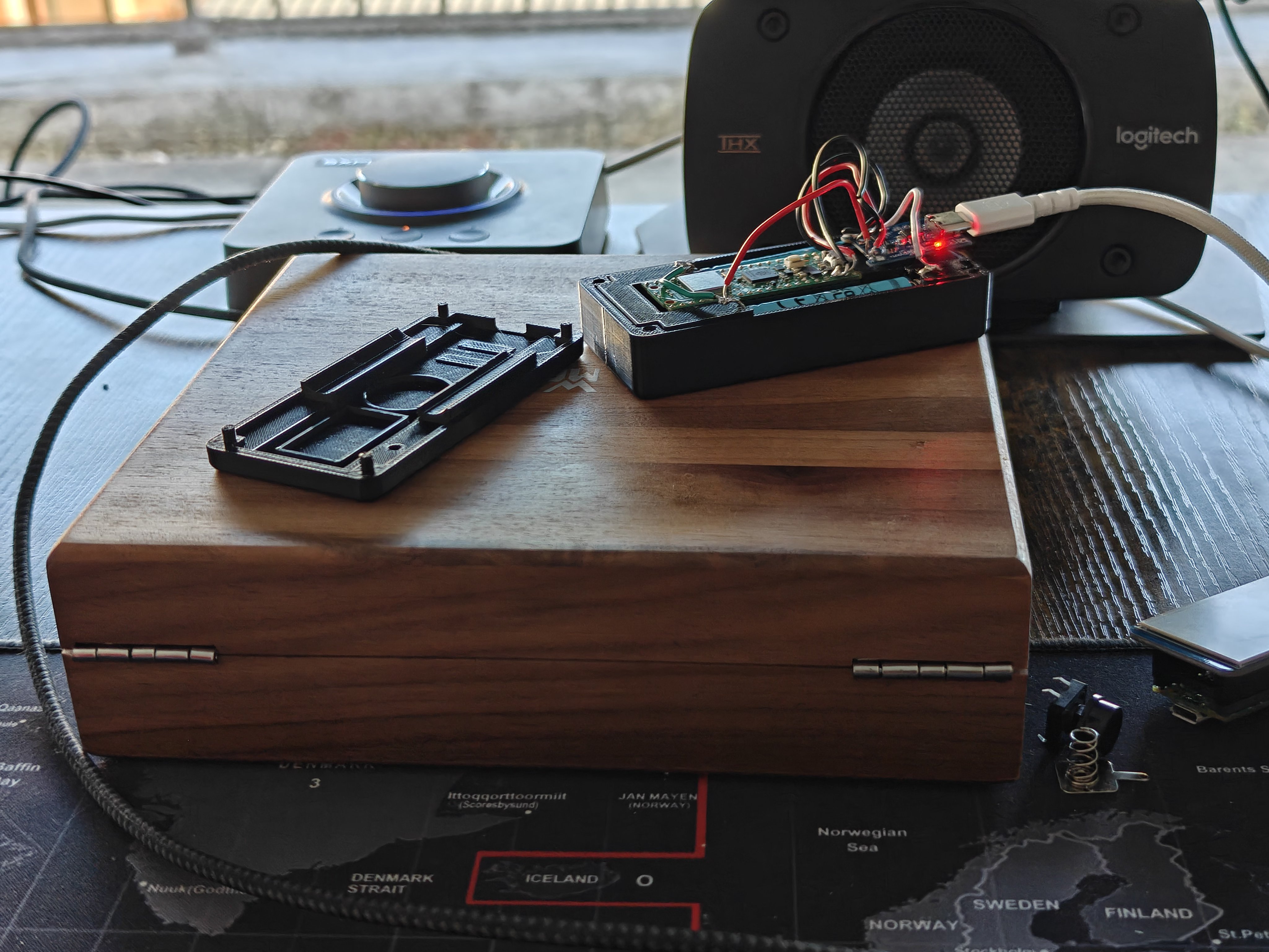 NoSolar variant wide view — thinner case on the workbench with soldering supplies
