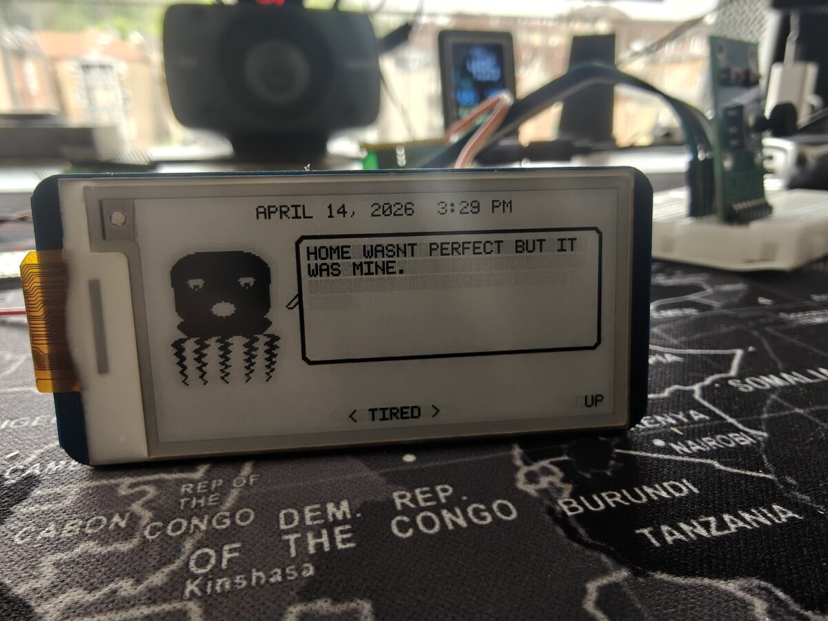 Joystick mood selector showing TIRED mood with UP input