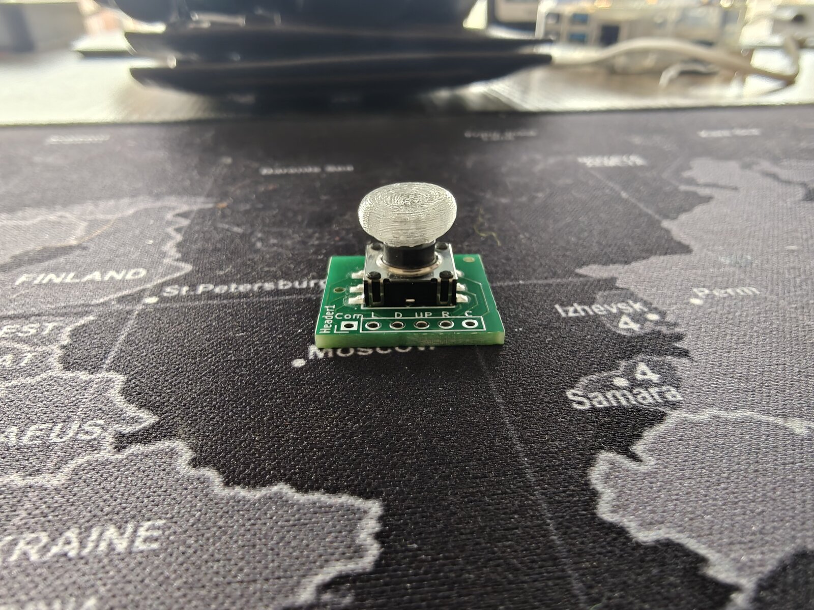 Joystick breakout PCB from JLCPCB with 3D-printed thumbpiece snap cap fitted on the K1-1506SN-01 switch actuator